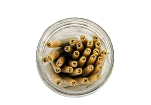 Glass jar containing pre-rolled cannabis joints, symbolizing the pre-rolls category containing flavor-infused pre-rolls.